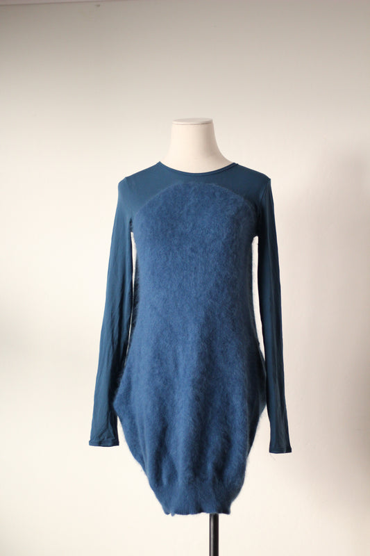 Front view of Alexander McQueen Fall/Winter 2007 blue angora sweater dress featuring long sleeves, a round neckline, a fuzzy textured front panel, and a cocoon-shaped silhouette.
