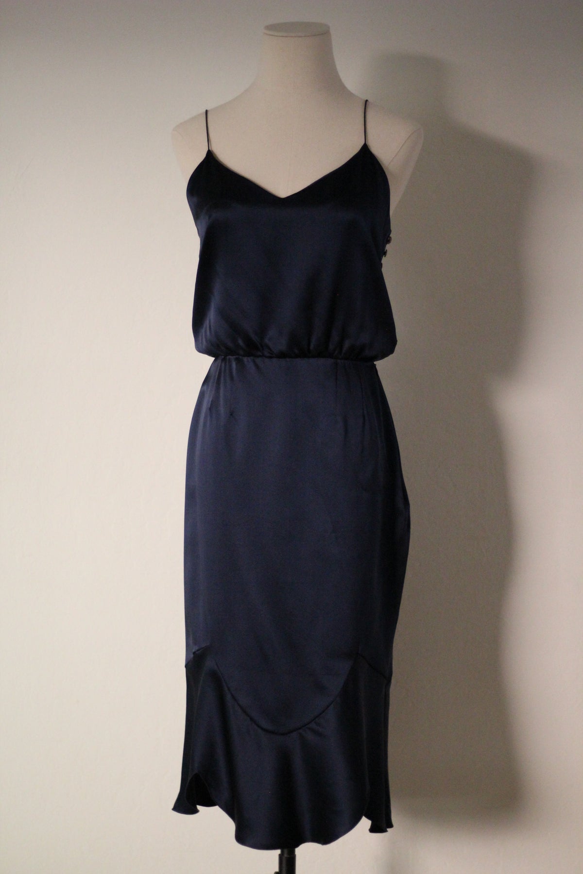 Full front view of the Chloé Spring/Summer 1999 navy blue silk runway dress featuring thin spaghetti straps, a softly draped bodice, fitted waist, and curved seam detailing with a flared hem.