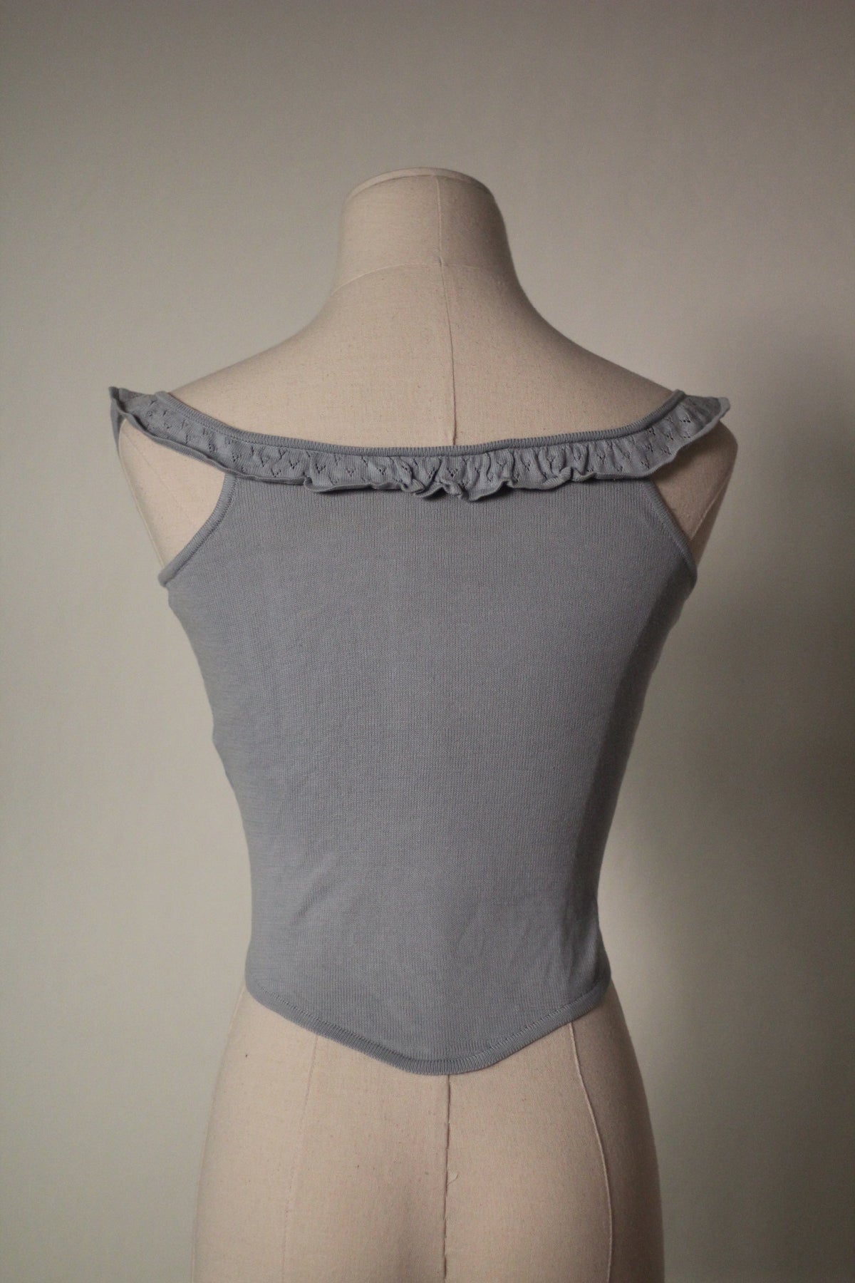 Back view of the gray Chloe by Stella McCartney S/S 1999 tank top, showing its ruffled straps and fitted ribbed knit construction