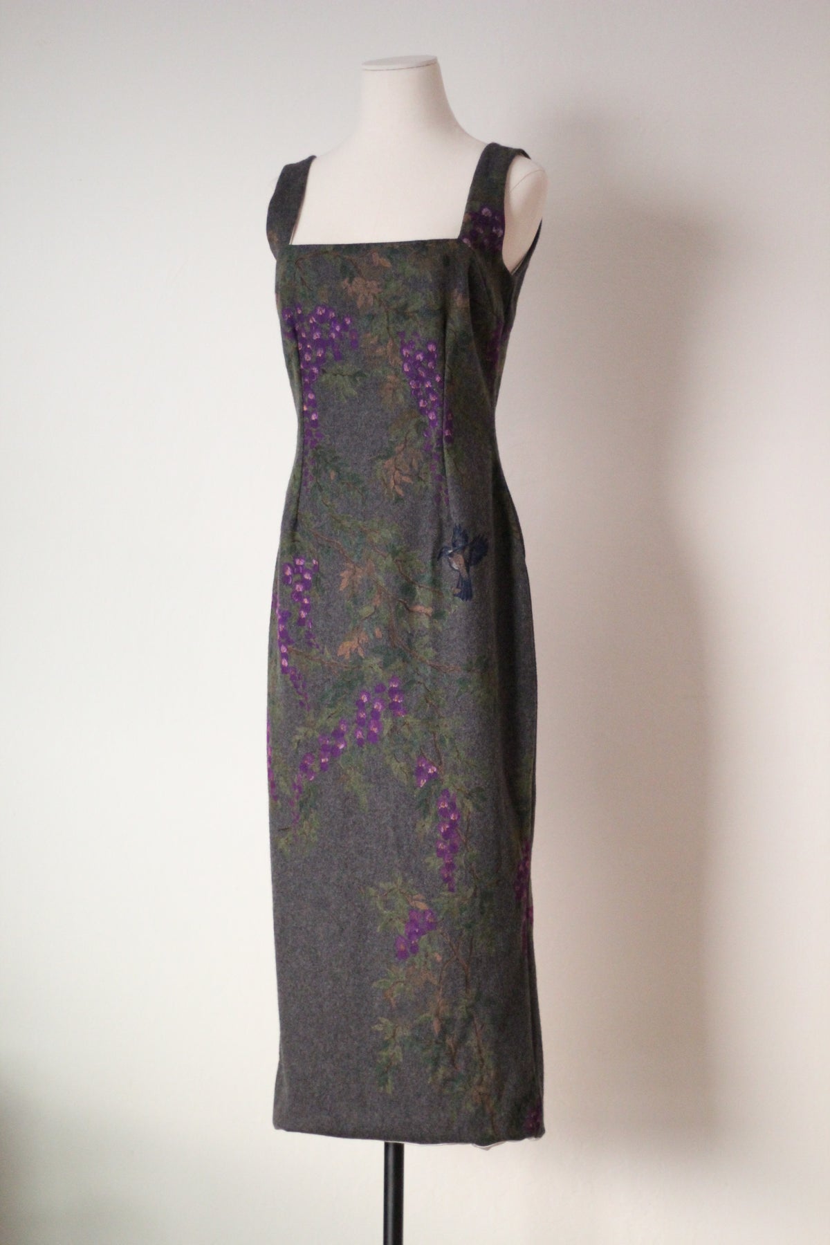 Front view of vintage Dolce & Gabbana Fall/Winter 1998 runway dress featuring a square neckline, wide shoulder straps, and purple wisteria and bird print on gray fabric.