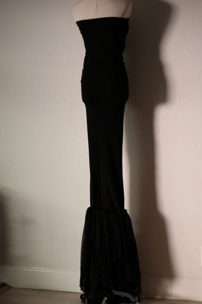 Full-length view of the black Dolce & Gabbana Fall/Winter 1991 mermaid gown, with a fitted body and flared ruffled silk hem