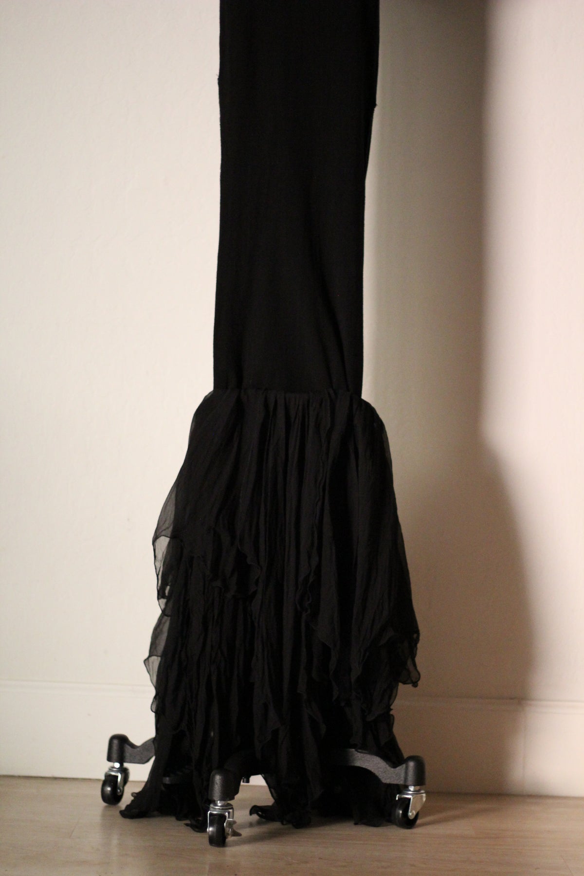 Close-up of the flowing black silk ruffled hem on the Dolce & Gabbana Fall/Winter 1991 mermaid gown