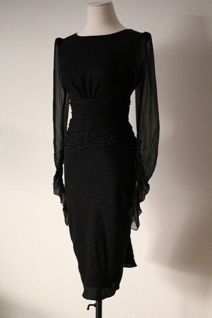 Front view of Emanuel Ungaro FW 2006 black dress with plunging V-neckline, sheer long sleeves, and ruched waist