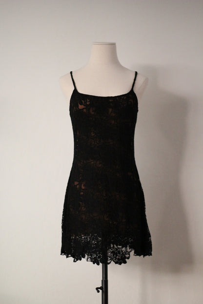 Full front view of Rifat Ozbek Spring/Summer 1994 black lace runway mini dress featuring thin spaghetti straps, a square neckline, floral lace overlay, and a scalloped lace hem.