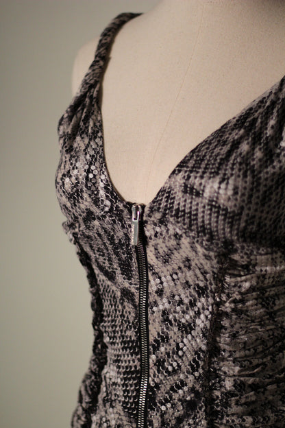 Close-up of the Roberto Cavalli Fall/Winter 2003 reflective snake print top featuring a plunging V-neckline, silver front zipper, and ruched side detailing. 