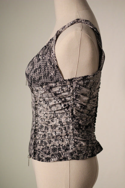 Side view of the Roberto Cavalli Fall/Winter 2003 reflective snake print top featuring a low-cut neckline, wide shoulder strap, and ruched side detailing.