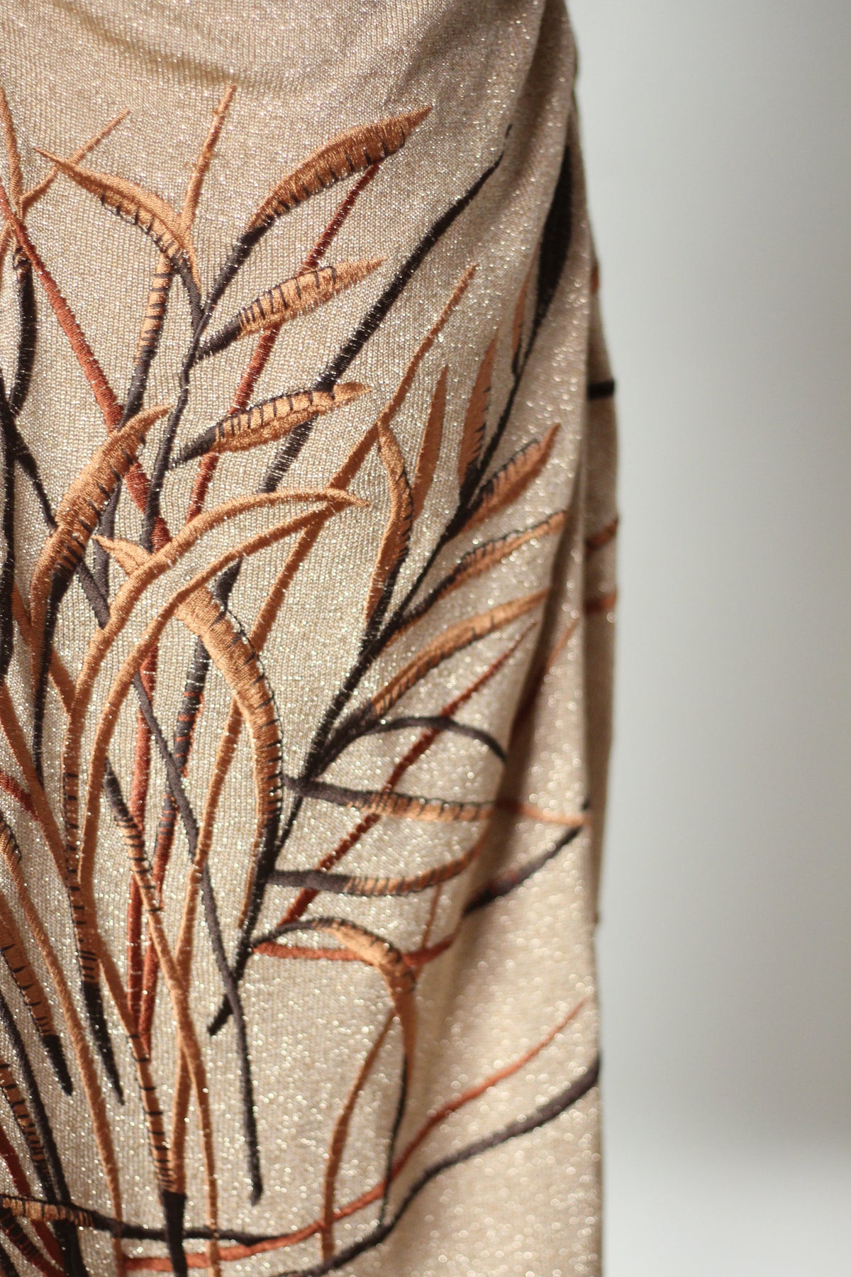 Embroidered leaf detail on Valentino FW 1997 gold dress