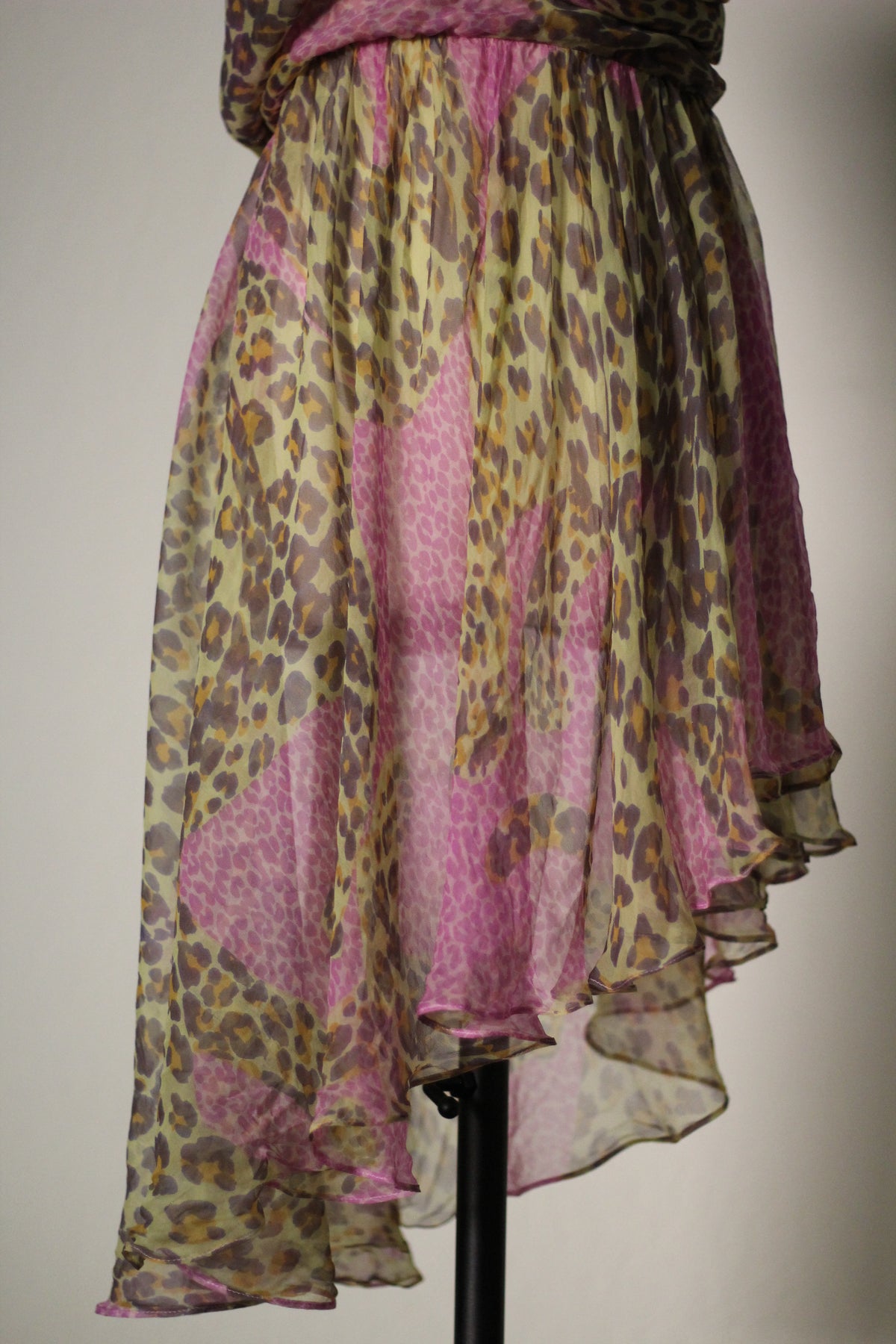Close-up of the sheer pink and olive leopard print silk skirt on a vintage Yves Saint Laurent dress